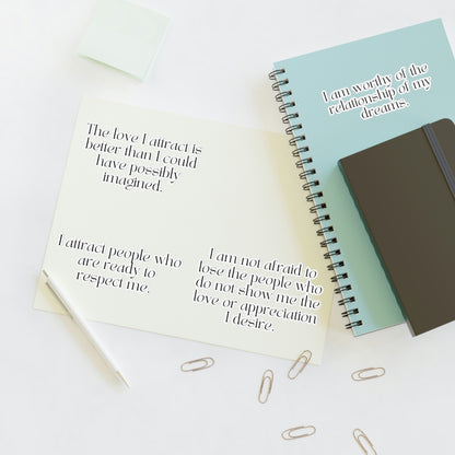 Affirmations for love stickers displayed on a journal.