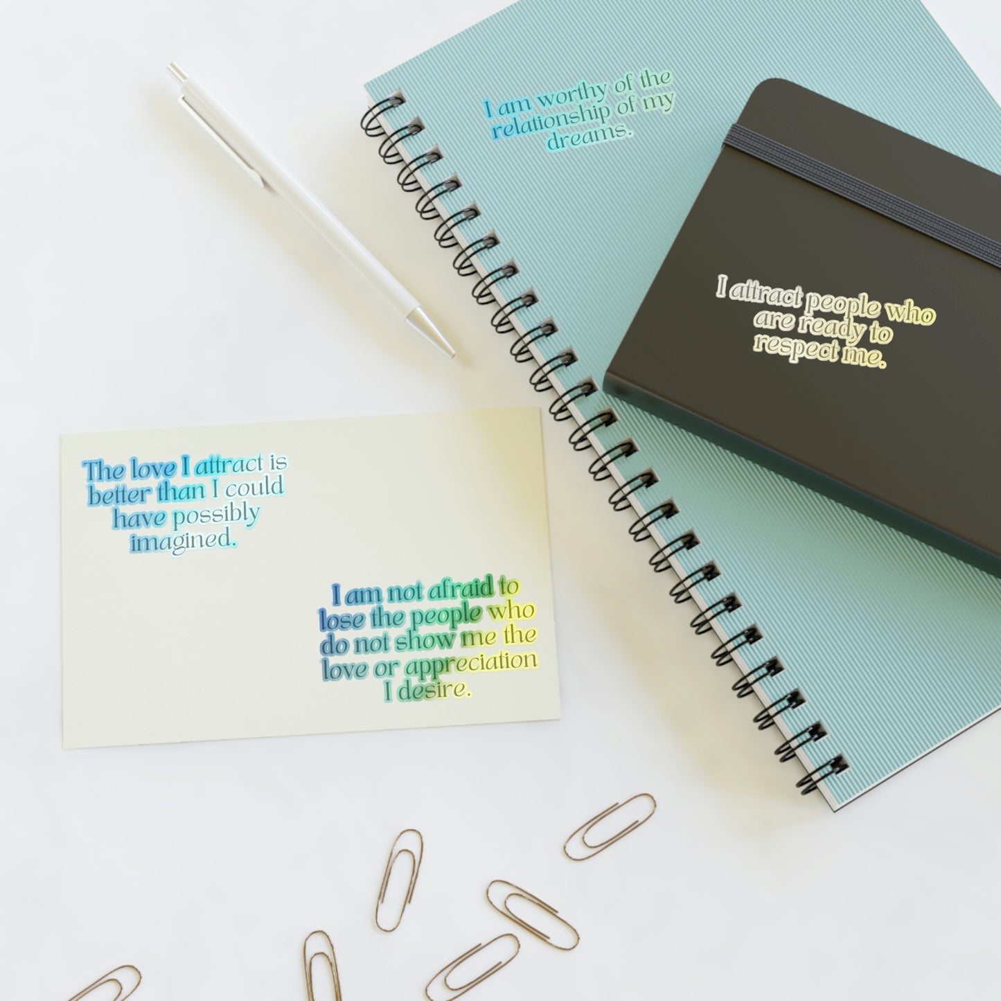 Long affirmations for love and attracting relationship, holographic stickers on a journal.