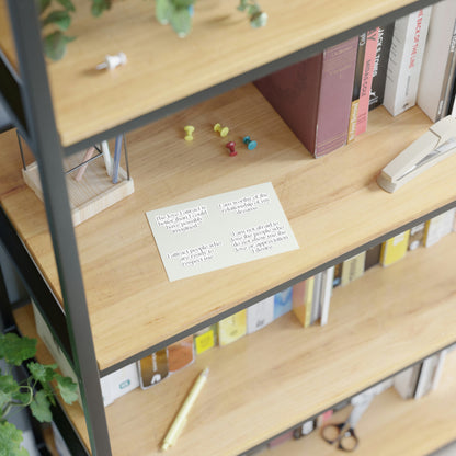 Sticker sheet of love affirmations for manifesting a relationship displayed on a shelf.