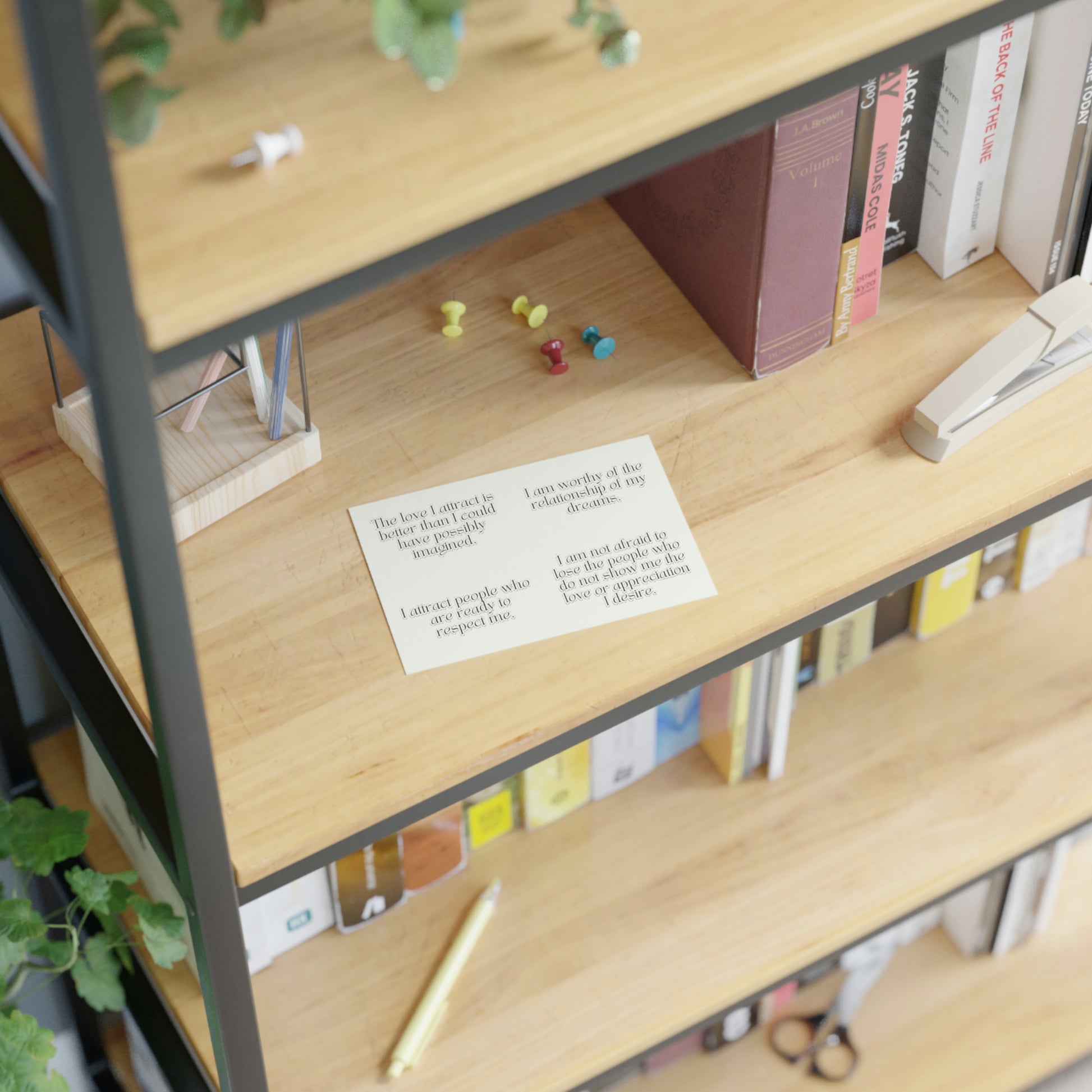 White background stickers with long love affirmations for manifesting a relationship, on a shelf.